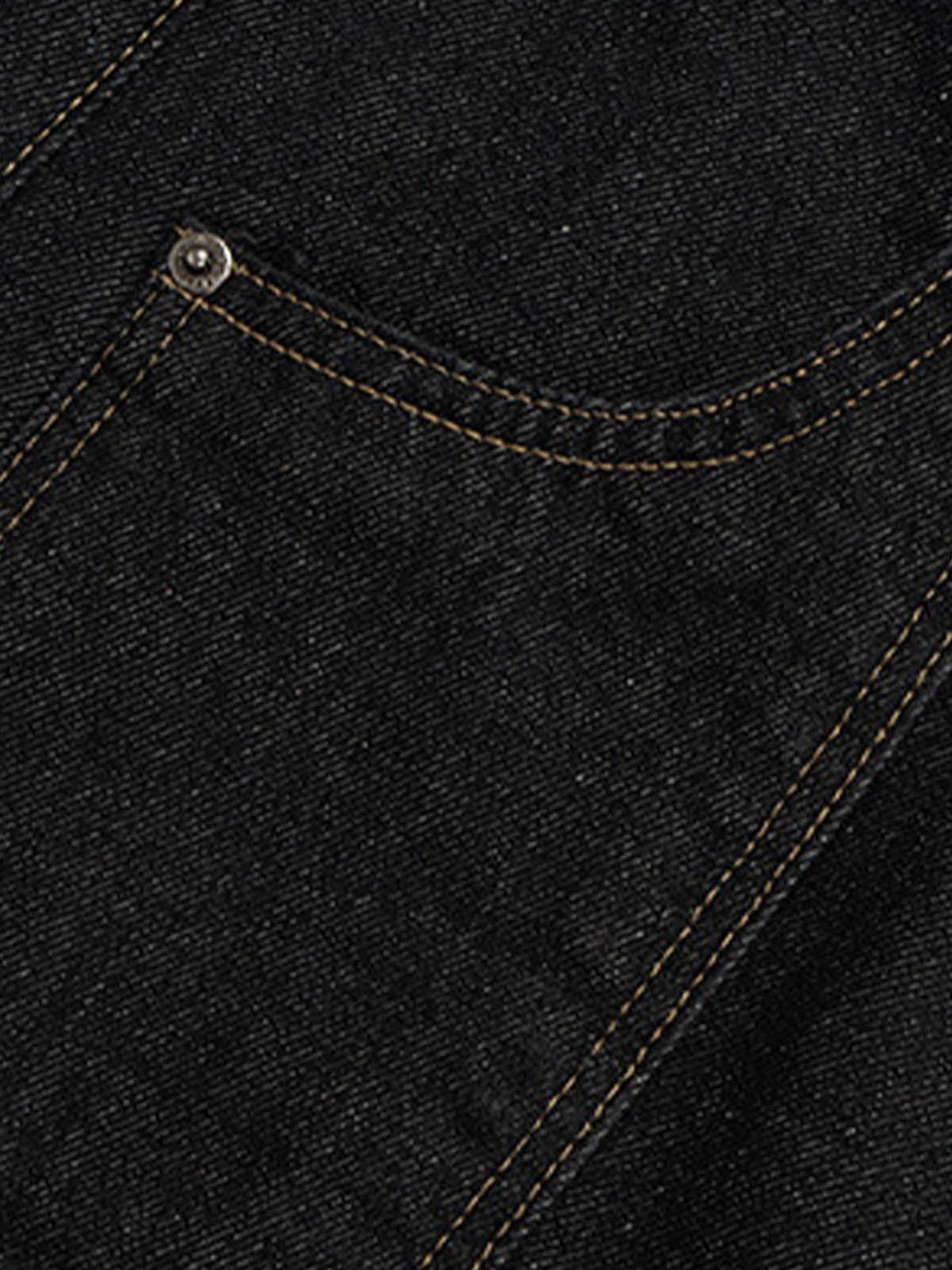 Intricate look at the stitching and texture of TALISHKO's black baggy jeans pocket detail.