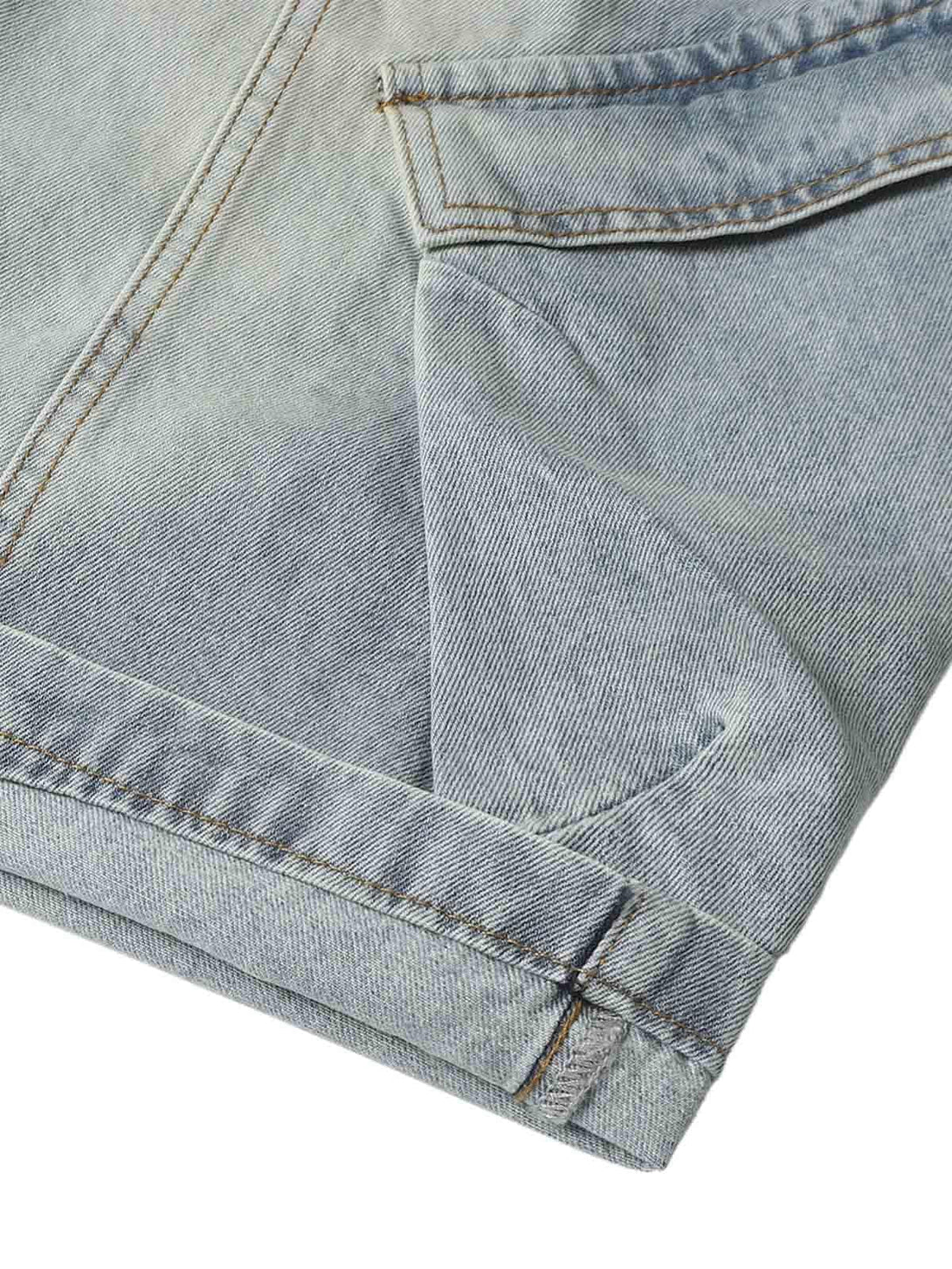 Intricate look at TALISHKO's denim stitching on baggy cargo jorts, perfect for relaxed wear.