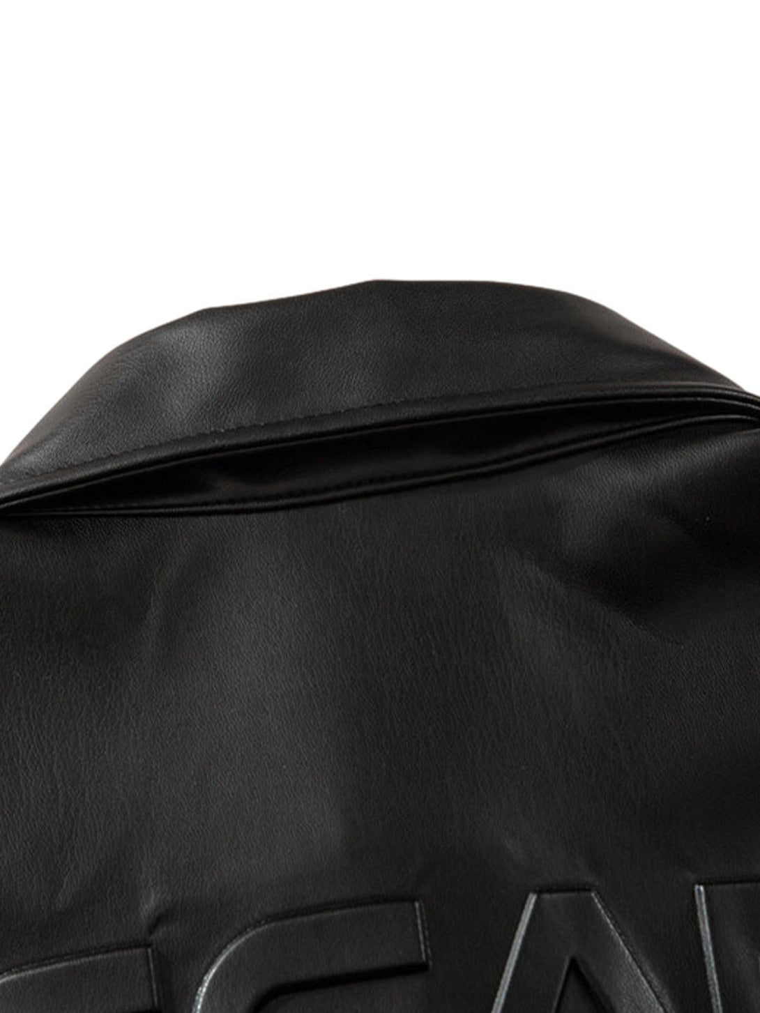 A detailed view of TALISHKO's black PU leather shirt, showcasing its textured back design.