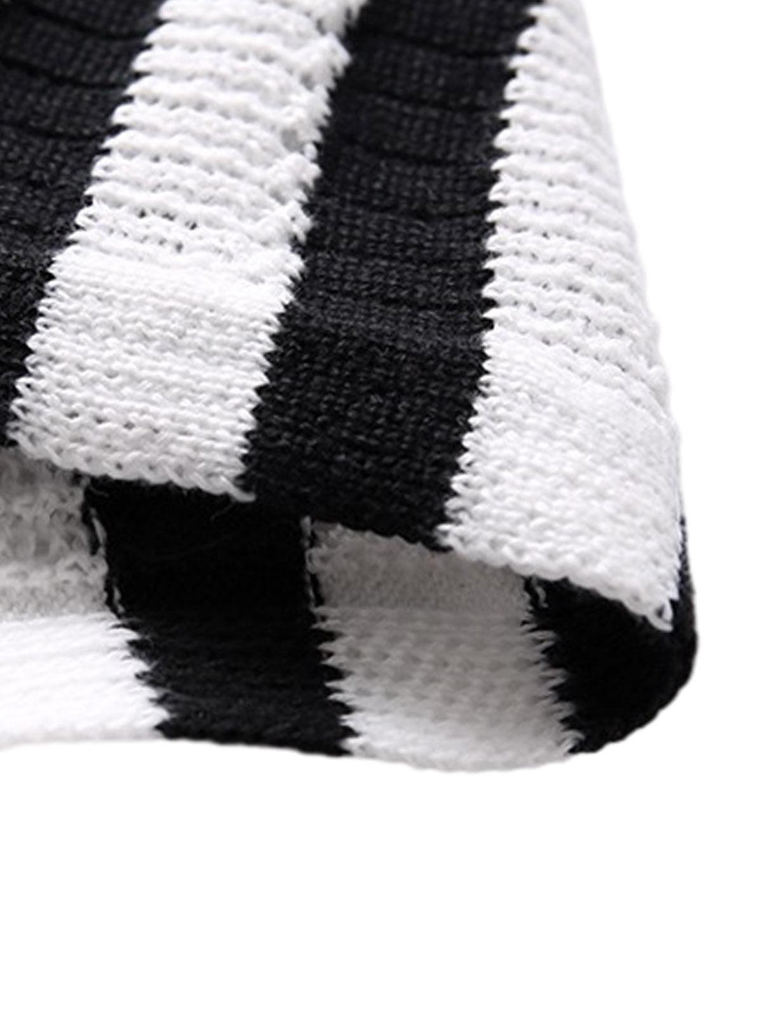 A detailed look at the black and white striped knit texture by TALISHKO, ideal for versatile styling.