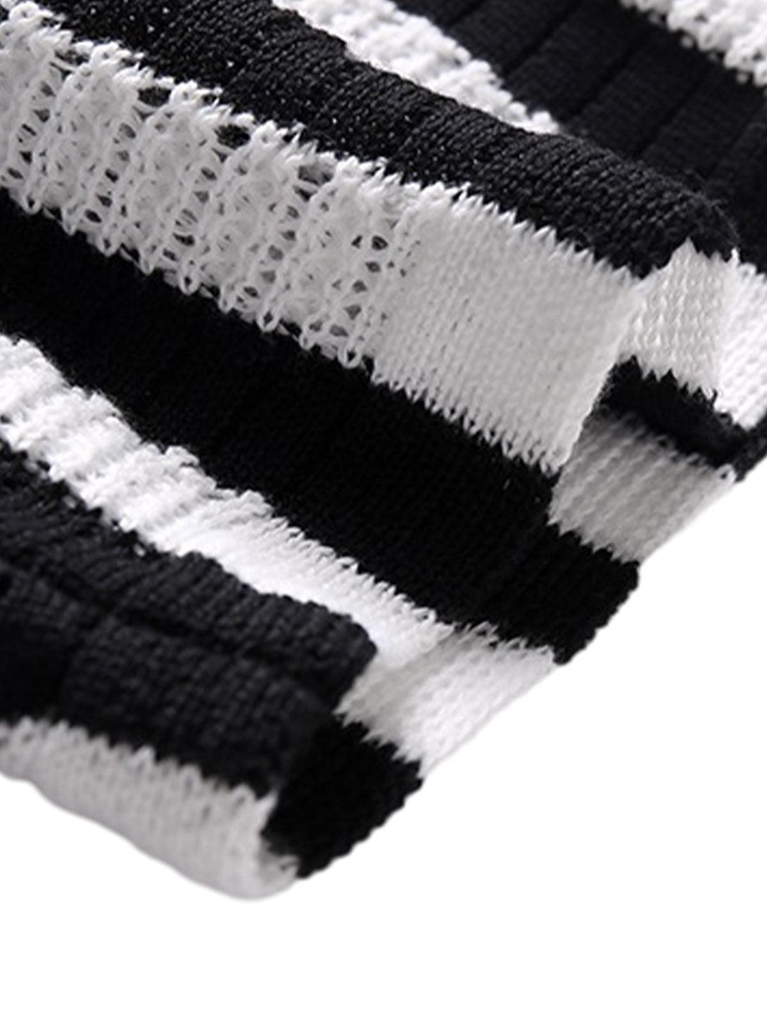 Intricate look at the black and white striped knit fabric by TALISHKO, highlighting texture.
