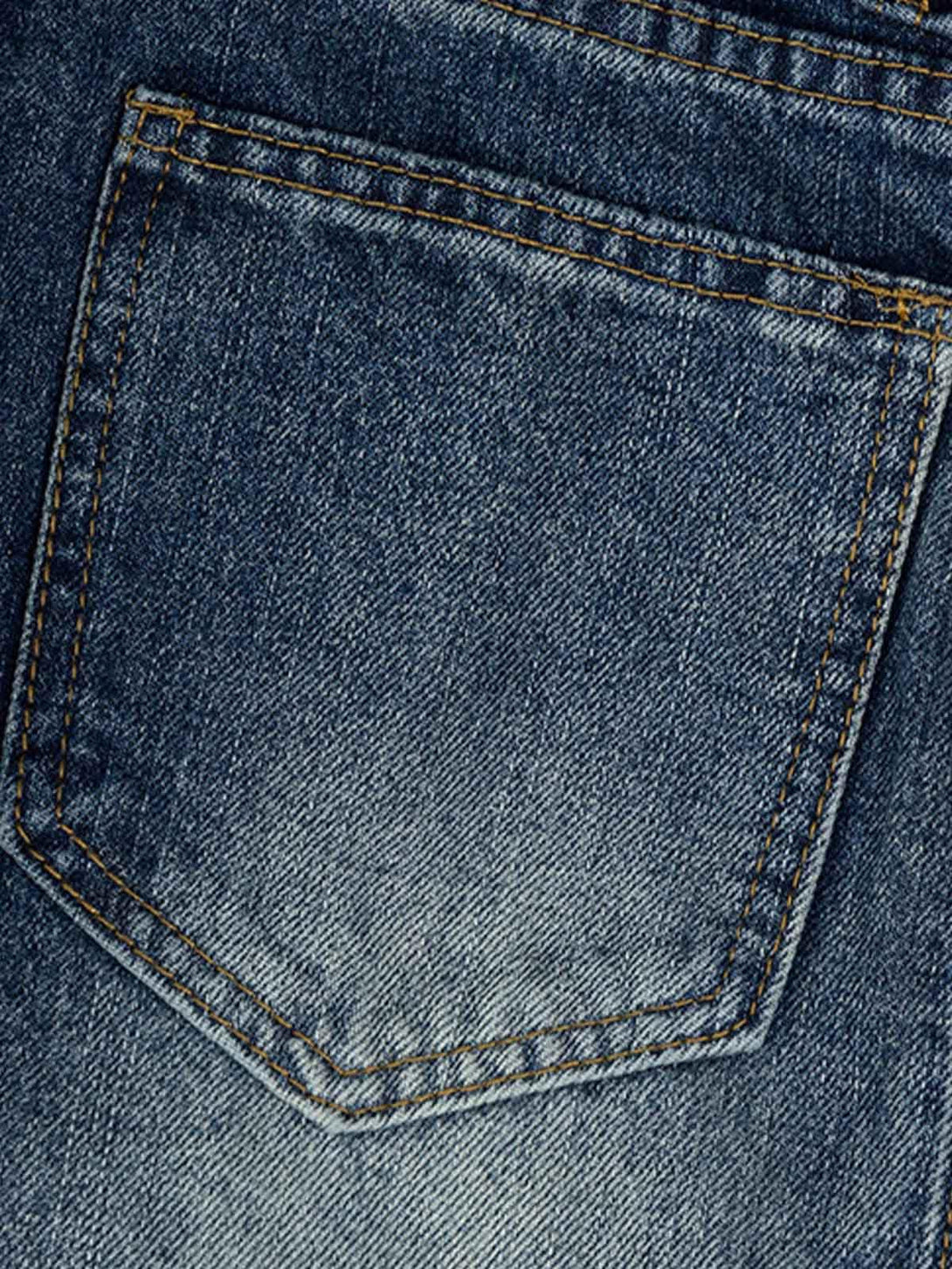 A detailed view of the pocket stitching on TALISHKO Cleanfit washed barrel jeans, highlighting denim craftsmanship.