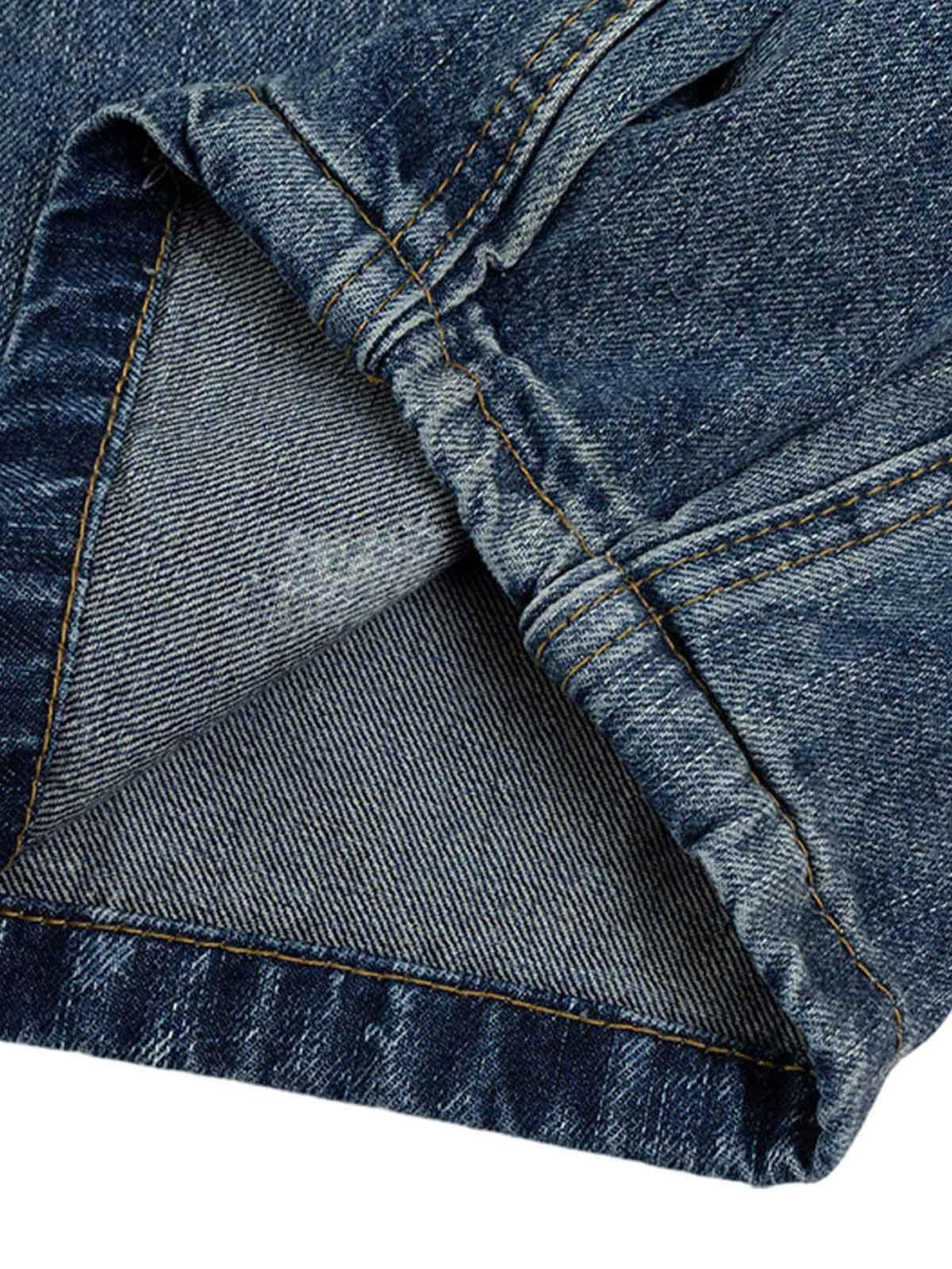 Detailed fabric and stitching of TALISHKO Cleanfit washed barrel jeans, highlighting denim texture.