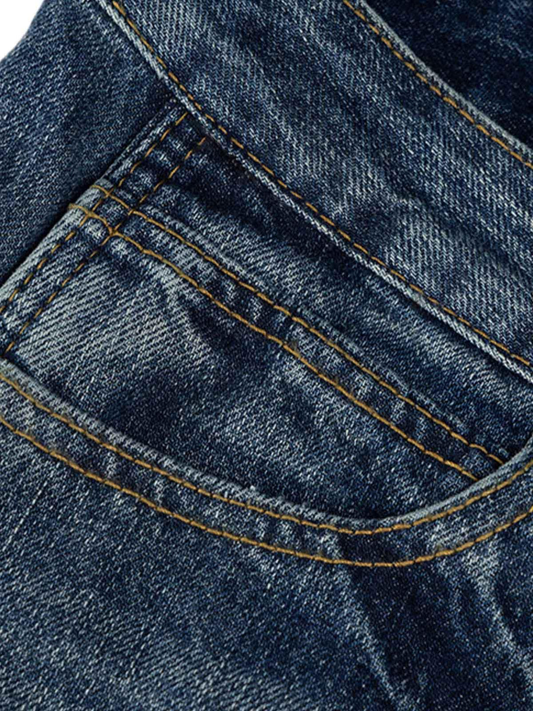 Focusing on the sturdy stitching of TALISHKO Cleanfit washed barrel jeans, showcasing denim artistry.