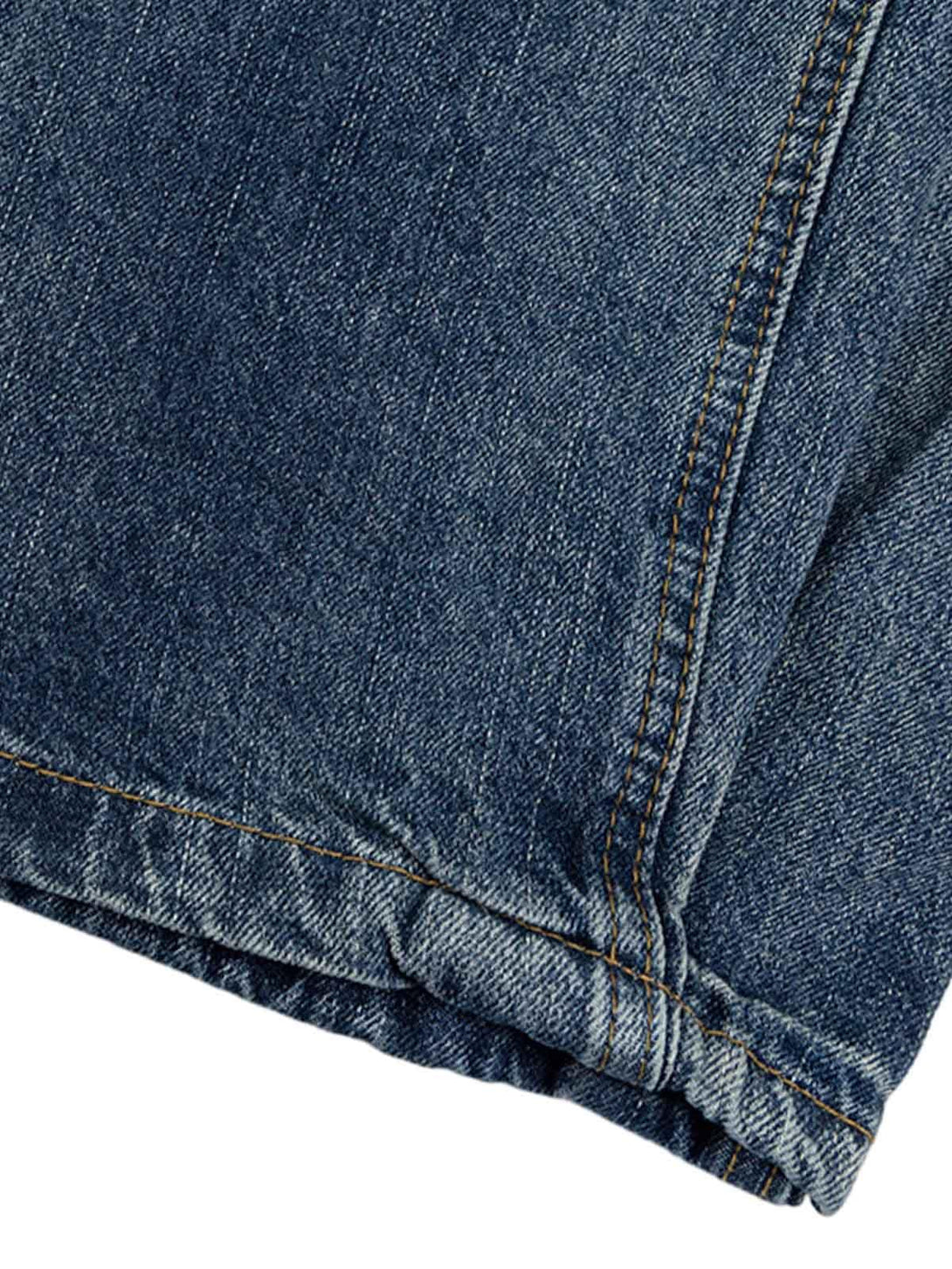 Zoomed-in texture of TALISHKO Cleanfit washed barrel jeans, highlighting detailed denim stitching.