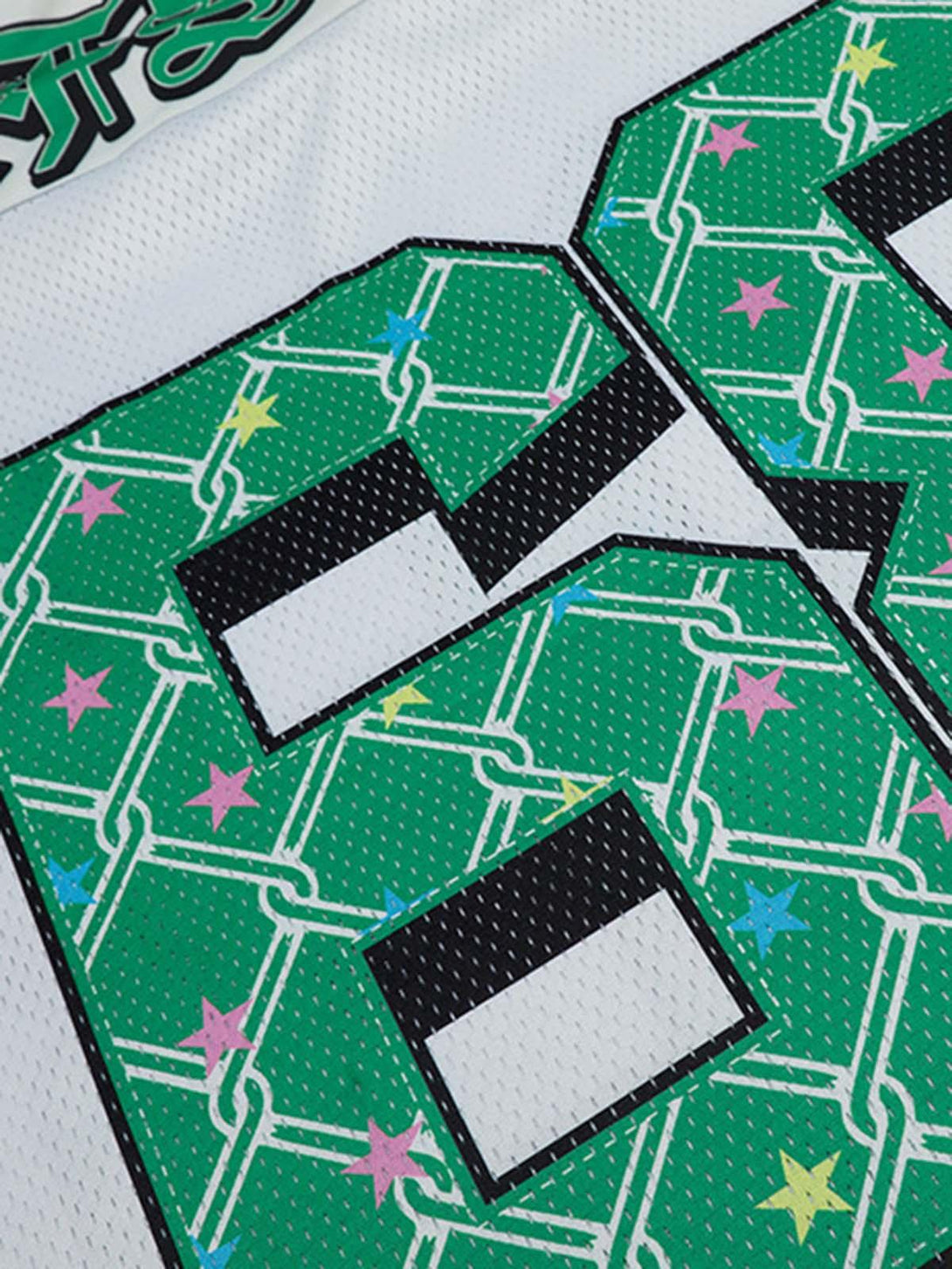 Zoomed-in detail of TALISHKO Club 68 jersey t-shirt, highlighting vibrant green patterns.