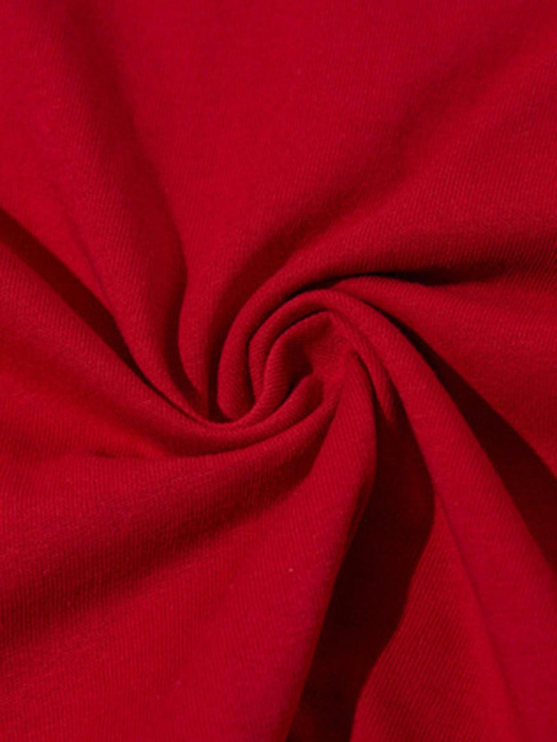 Zoomed-in texture of red fabric by TALISHKO, highlighting its smooth and vibrant quality.