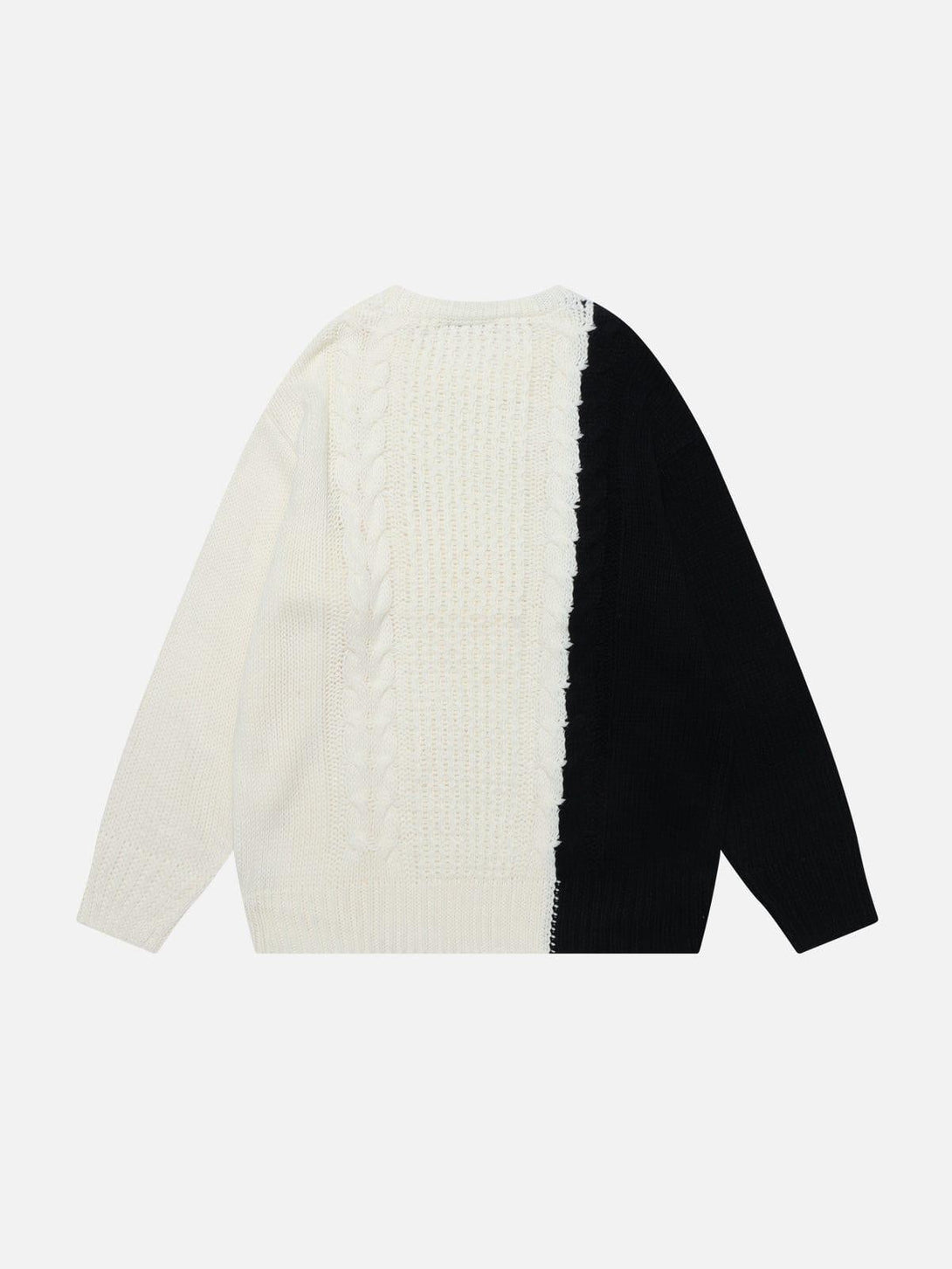 Back view of TALISHKO color-block patchwork sweater in black and white with cable knit detail.