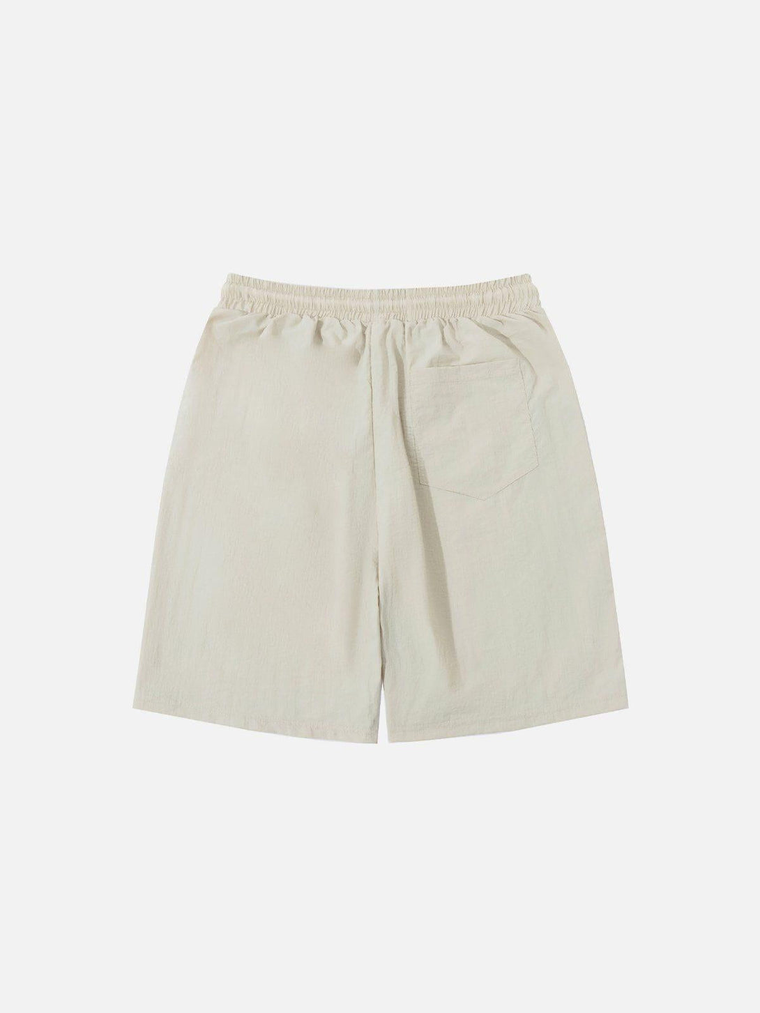 Back view of light-colored shorts by TALISHKO, featuring an elastic waistband and pocket.