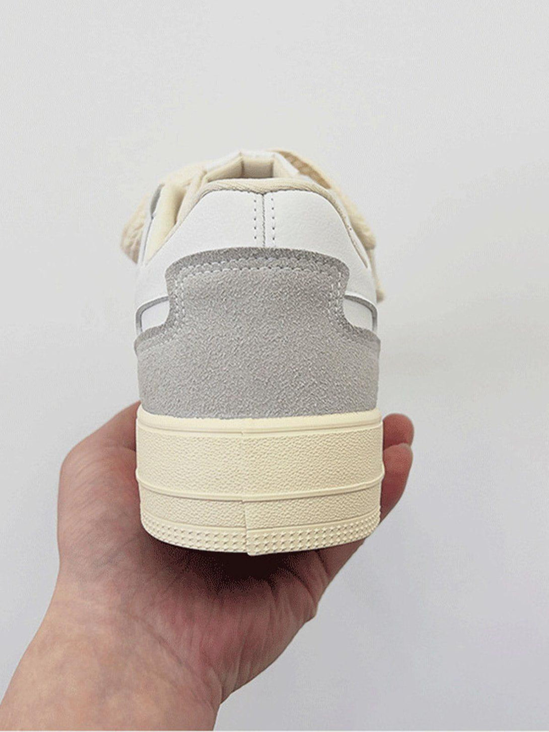 TALISHKO skate shoes with rope trim and colorblock design, showcasing the back view.