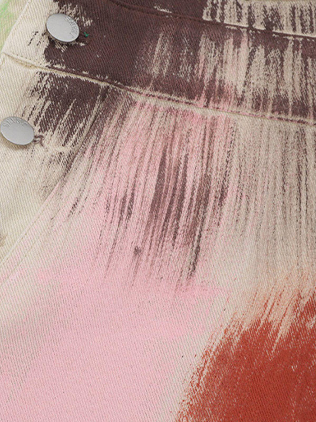 Detailed fabric and stitching of TALISHKO overalls, featuring vibrant, artistic brushstroke patterns.