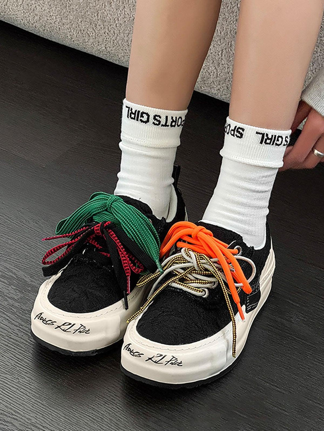 TALISHKO sneakers with playful, colorful laces and bold design, highlighting trendy streetwear.