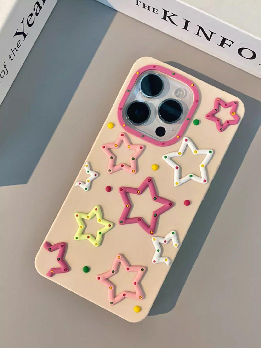 TALISHKO phone case featuring 3D stars in pastel colors, adding a whimsical touch to your device.