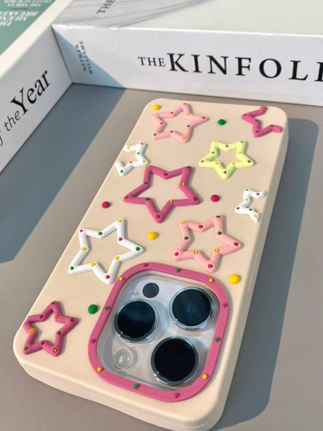 Playful TALISHKO phone case showcasing vibrant 3D stars, adding a fun twist to your device.