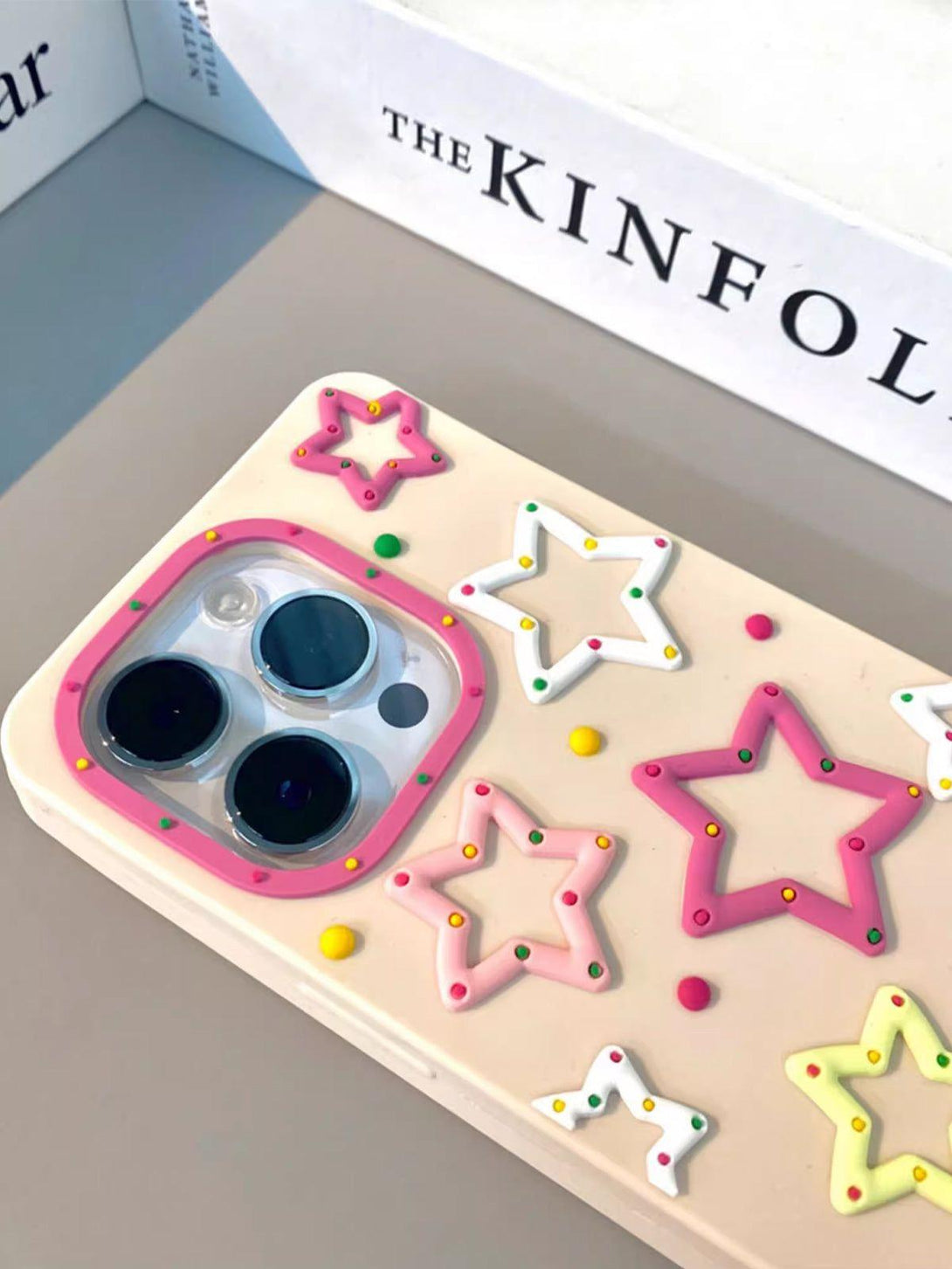 TALISHKO phone case with colorful 3D star designs adds a playful touch to your device.