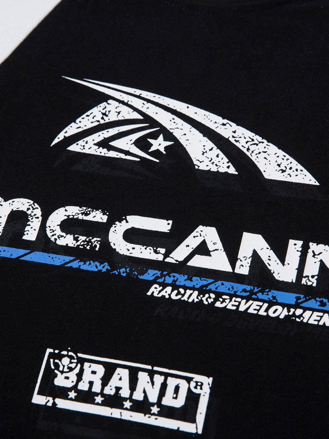 A close-up of TALISHKO motorcycle print T-shirt, highlighting the graphic and textured design.
