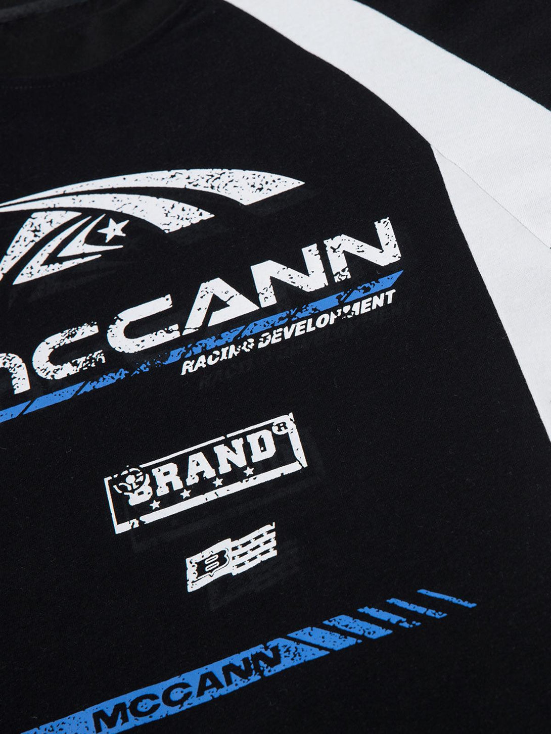 Zoomed-in view of TALISHKO motorcycle print T-shirt showcasing graphic details and contrast colors.