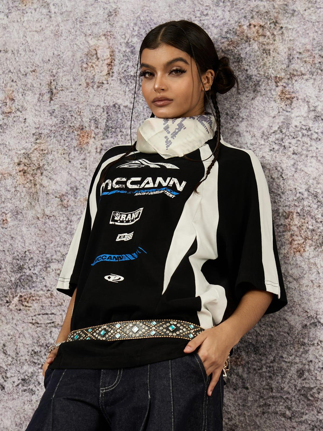 Model in a TALISHKO motorcycle print T-shirt, featuring contrast colors and casual style.