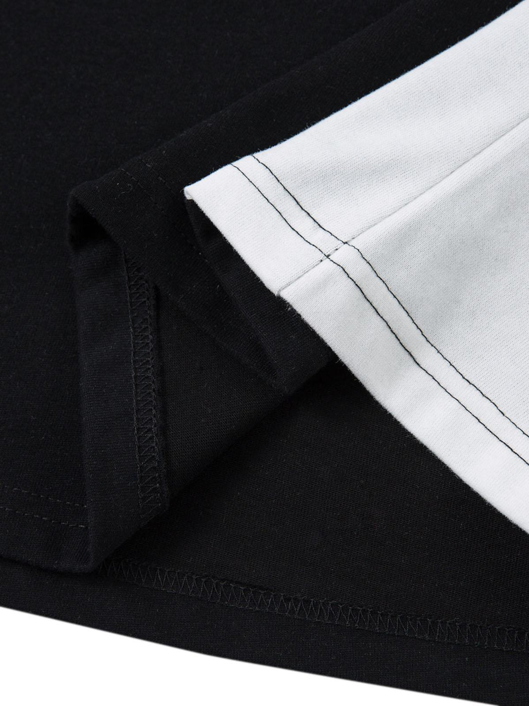 Detailed fabric and stitching on the TALISHKO motorcycle print T-shirt's contrast hem.