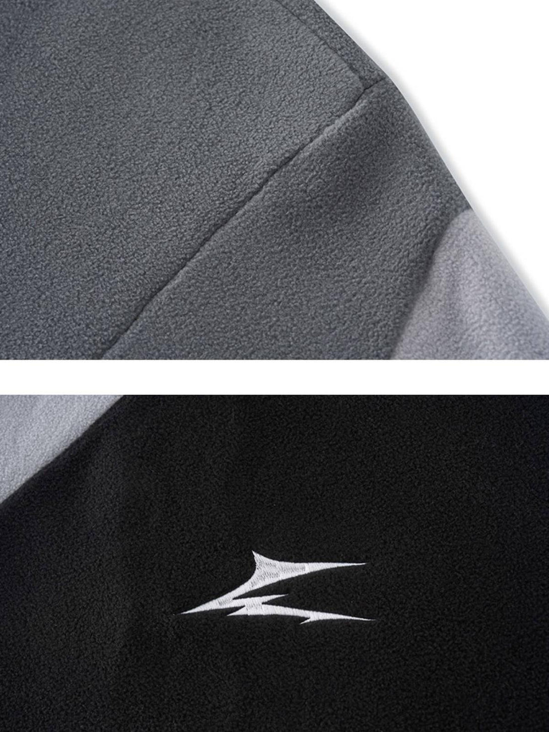 A close-up of TALISHKO's contrast panel hoodie, highlighting fabric texture and embroidered detail.