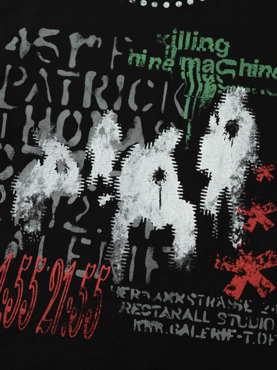 Zoomed-in texture of TALISHKO's bold patchwork print T-shirt with unique graphic details.