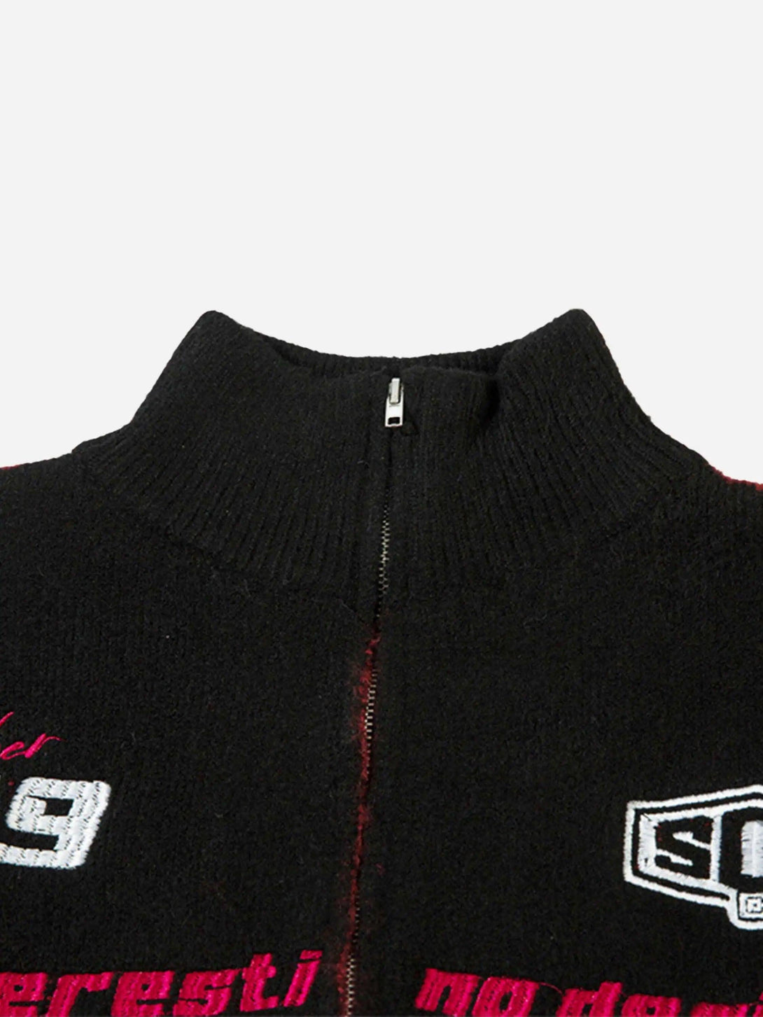 Detailed fabric and stitching on TALISHKO's black zip-up cardigan with racing graphics.