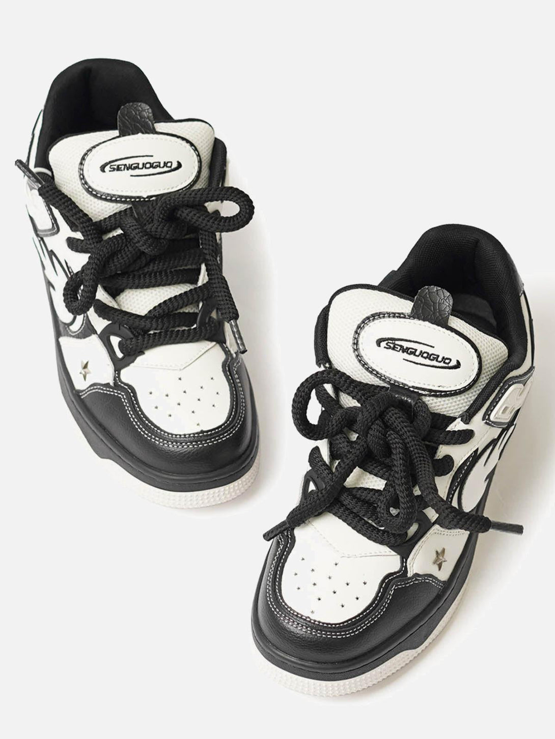 TALISHKO sneakers with black and white contrast and star details, front view highlighting design.