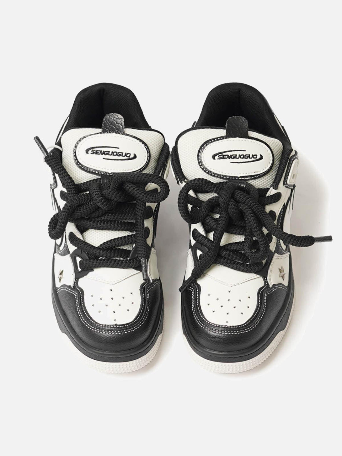 TALISHKO sneakers in black and white with star accents, showcasing a trendy, sporty look.