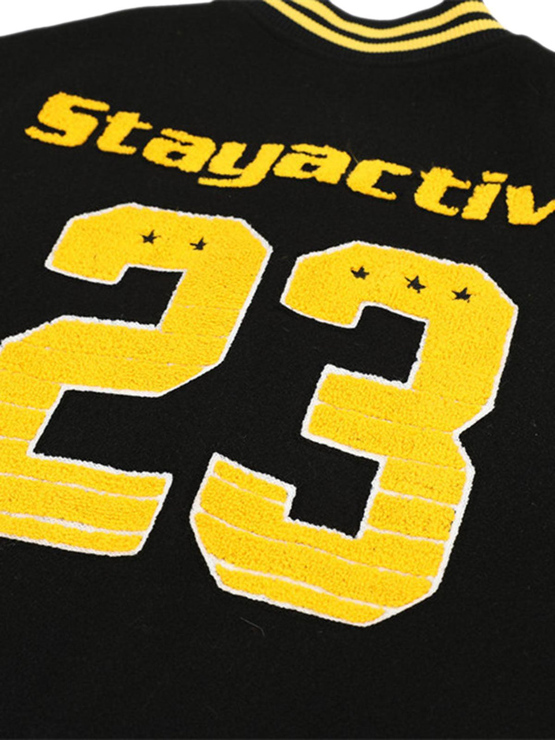 Back detail of TALISHKO bomber jacket featuring bold yellow "23" embroidery and "Stayactive" text.