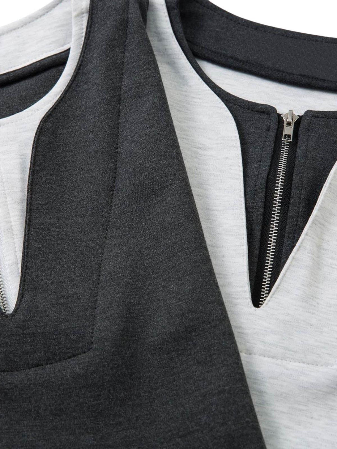 Detailed fabric and zipper feature of a faux two-piece T-shirt by TALISHKO.