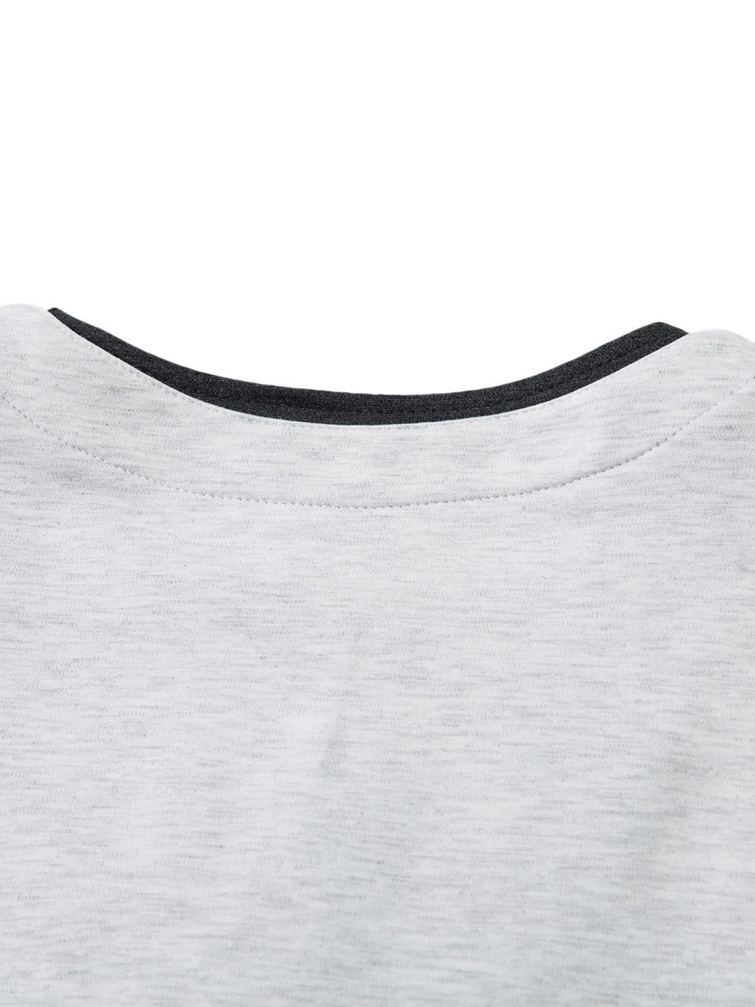 A detailed look at the neckline and stitching of a faux two-piece T-shirt by TALISHKO.