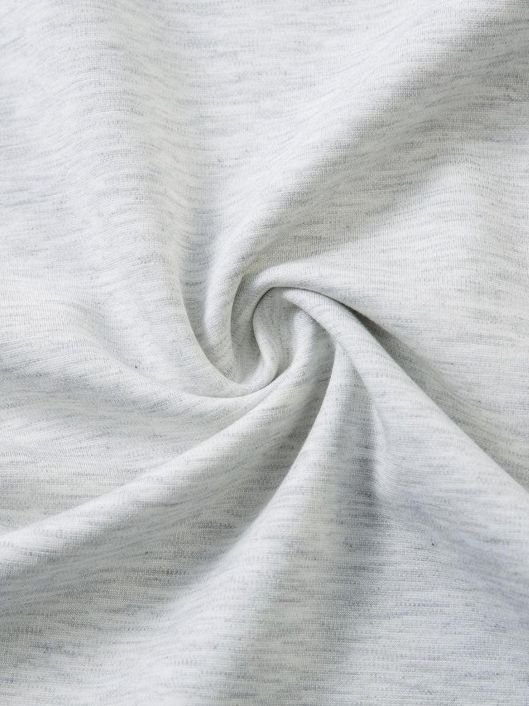 Zoomed-in texture of the soft fabric on a faux two-piece T-shirt by TALISHKO.