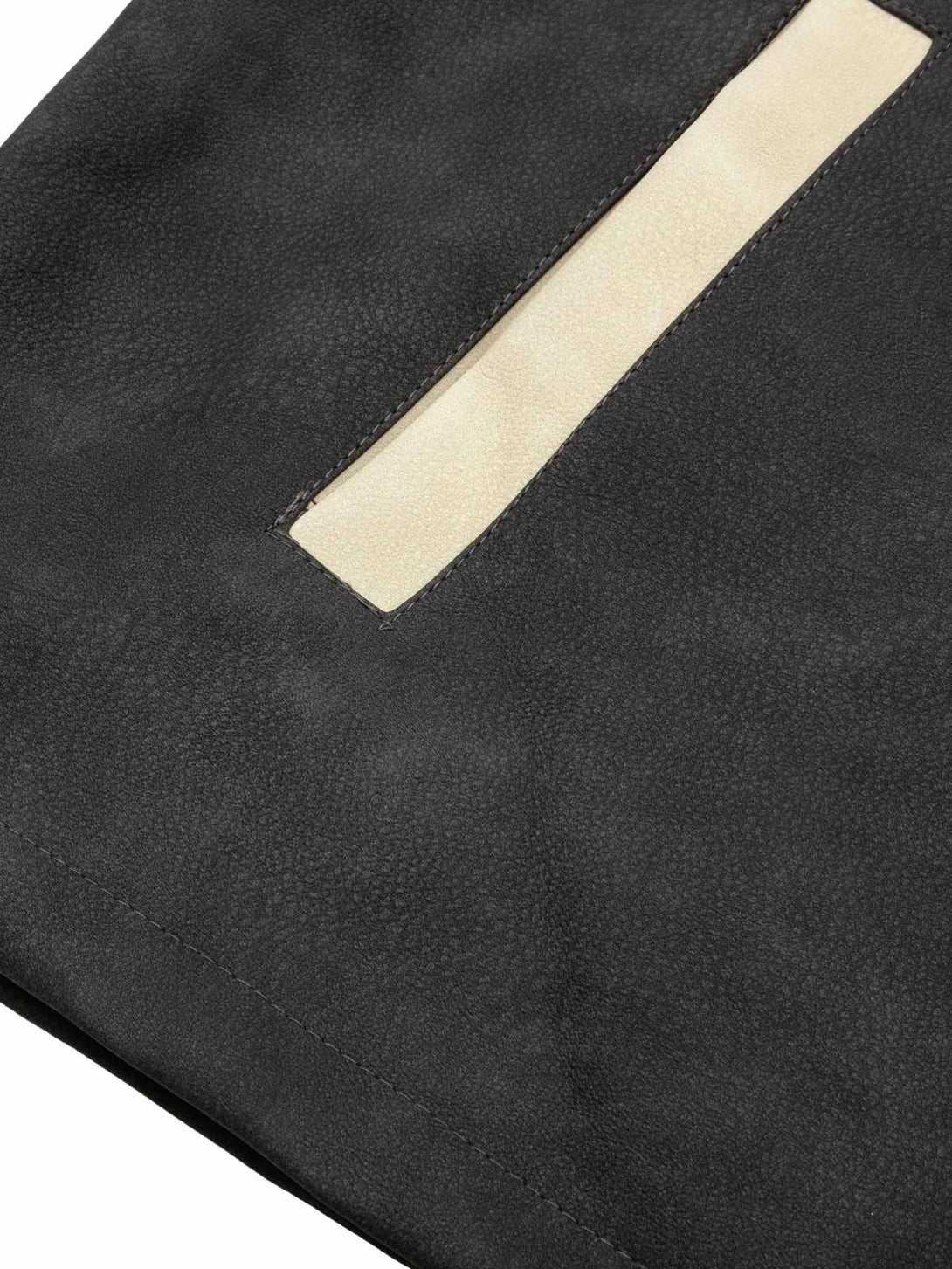 A detailed view of the sleek contrast color pocket on a TALISHKO suede PU leather jacket.