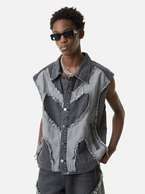 Model wearing a TALISHKO denim vest with heart stitching and frayed edges, styled for summer.