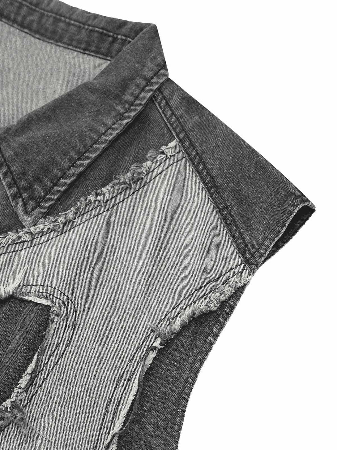 A close-up of TALISHKO's denim vest, highlighting frayed edges and heart stitching details.