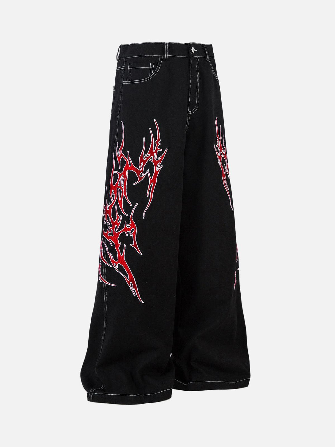 Side view of TALISHKO's black baggy jeans featuring bold red flame embroidery, perfect for streetwear.