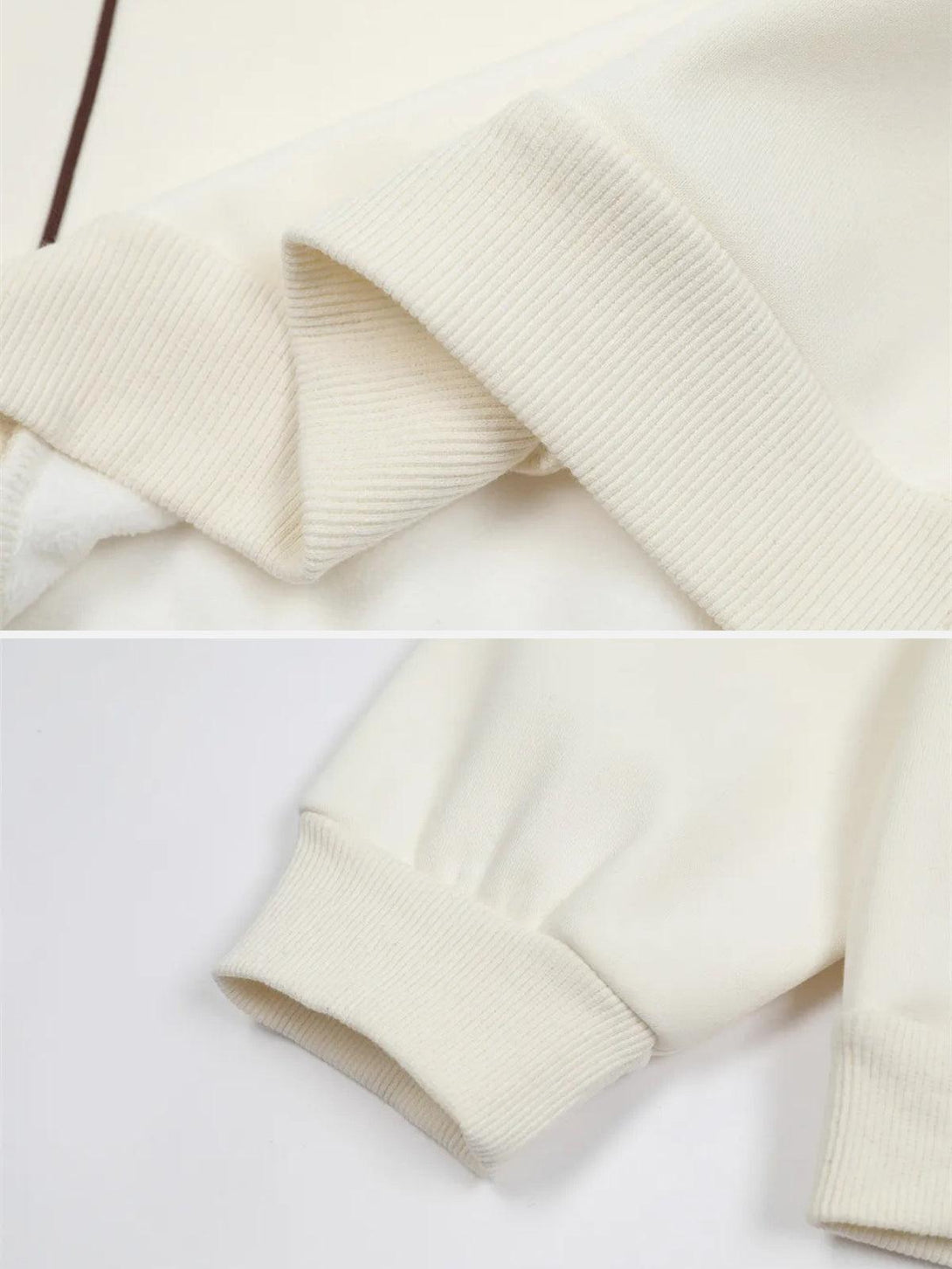 A detailed view of TALISHKO's sweatshirt sleeve, highlighting the soft ribbed cuffs.