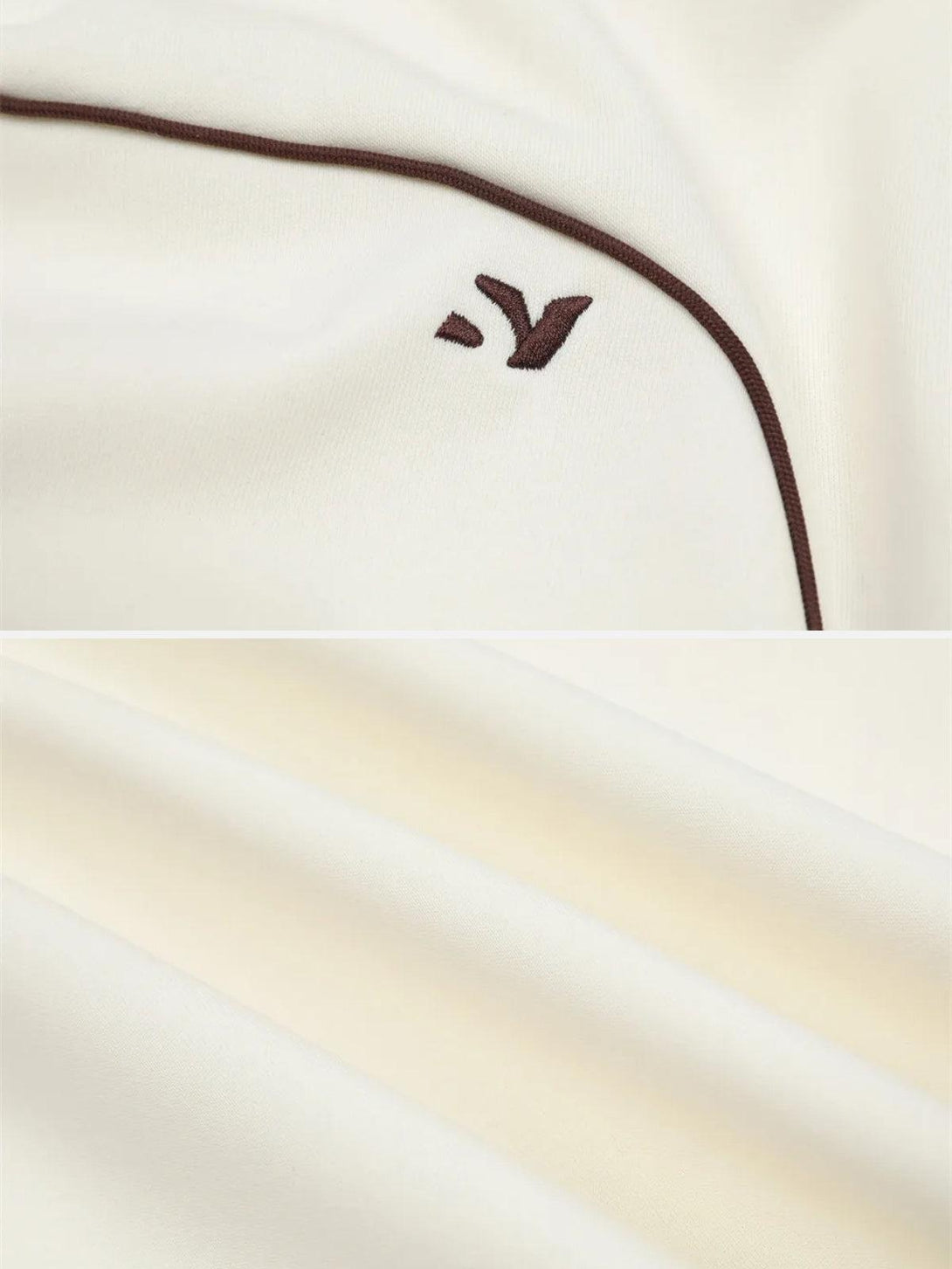 Intricate look at TALISHKO's contrast paneled embroidery and soft fabric texture in beige.