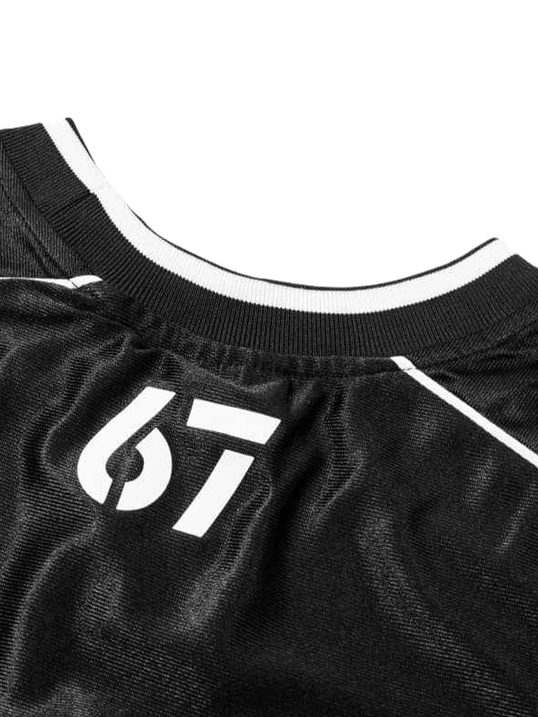 Detailed view of a black jersey T-shirt with contrast stitching and number design by TALISHKO.