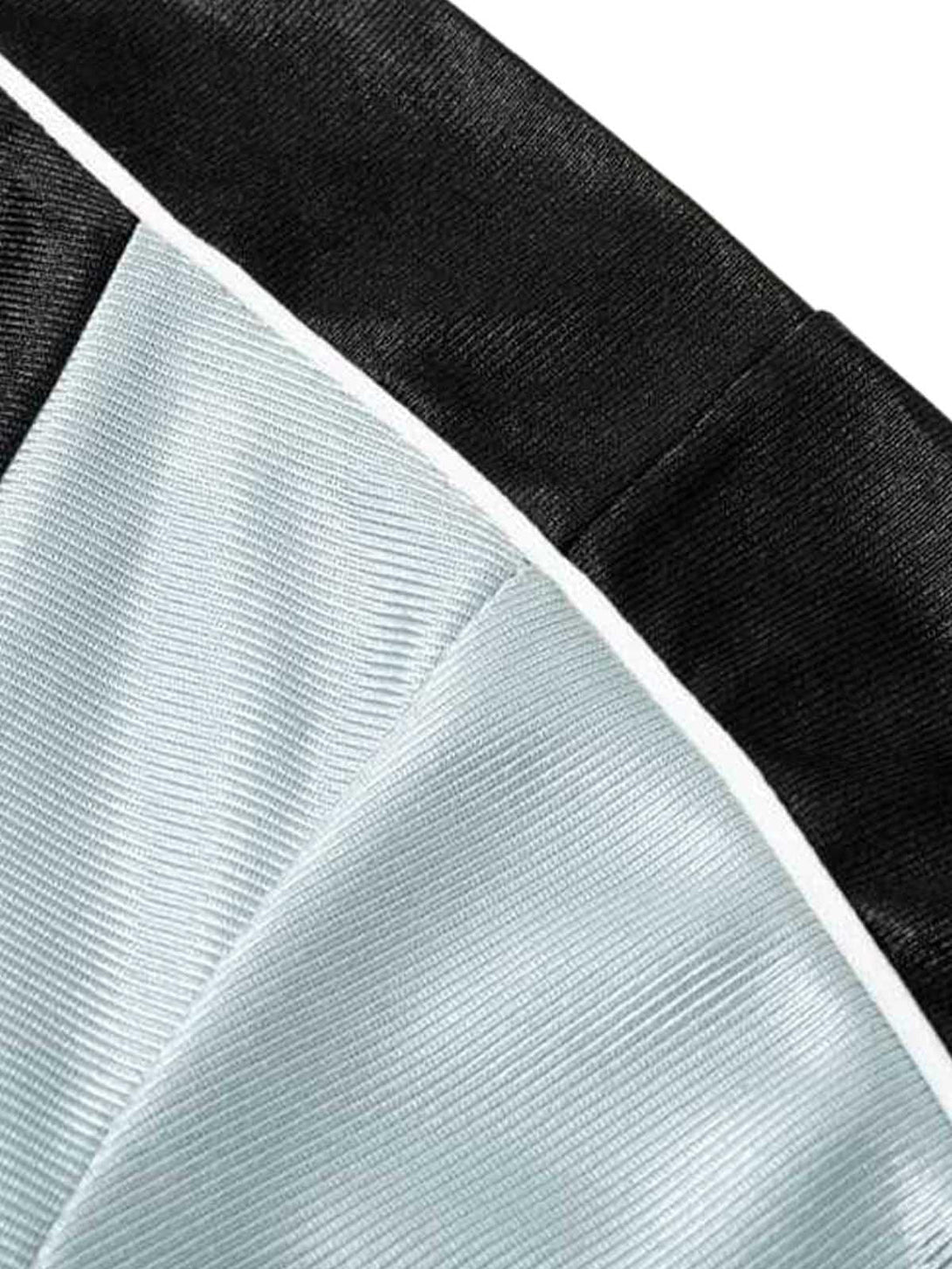 Zoomed-in texture of a jersey T-shirt with contrast stitching details by TALISHKO.