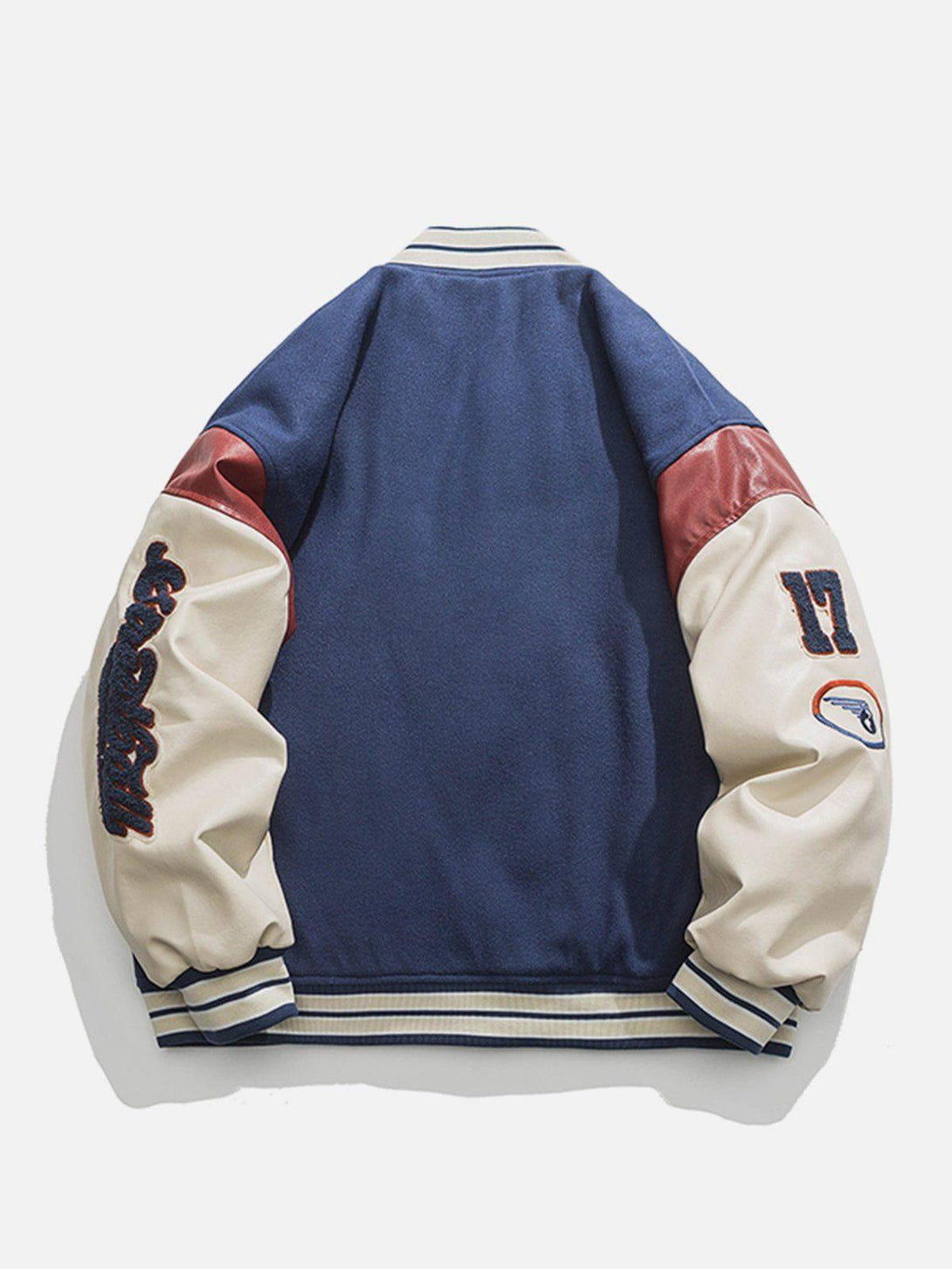 Back view of a TALISHKO varsity jacket featuring contrast stitching and bold sleeve patches.