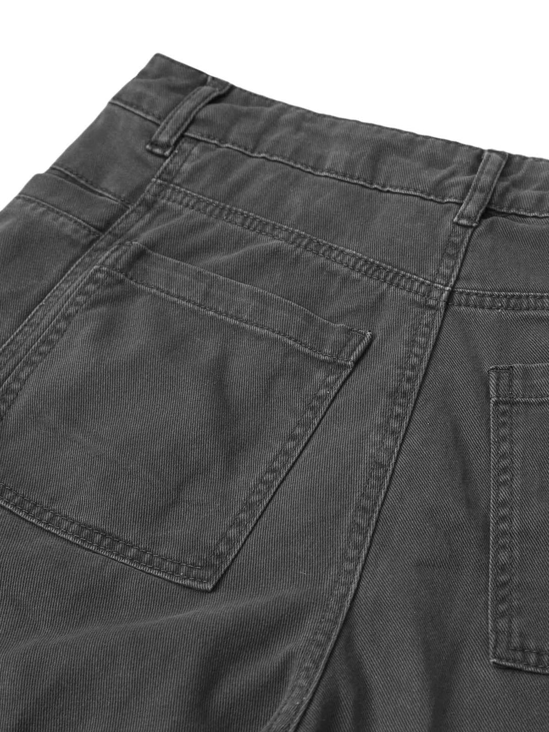 Intricate look at dark gray cargo pant pockets by TALISHKO, showcasing durable stitching.