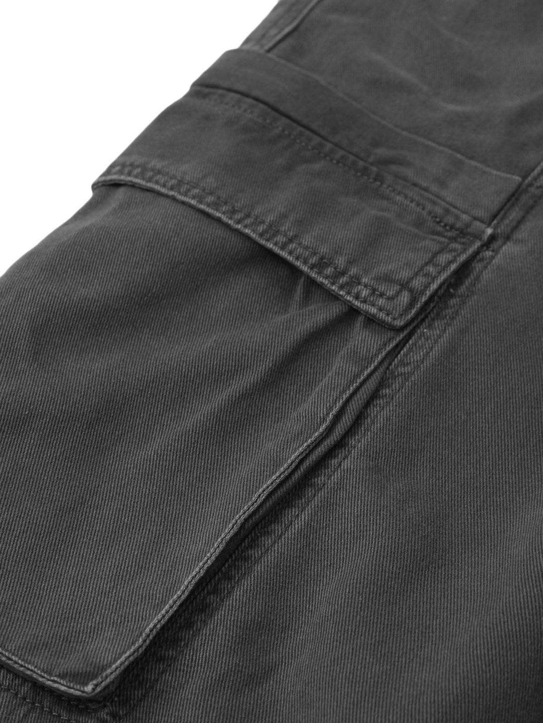 Detailed fabric and stitching on dark gray cargo pockets by TALISHKO, showcasing craftsmanship.