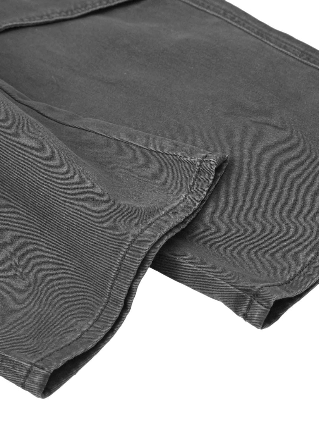 Zoomed-in texture of dark gray cargo pants by TALISHKO, highlighting durable stitching.