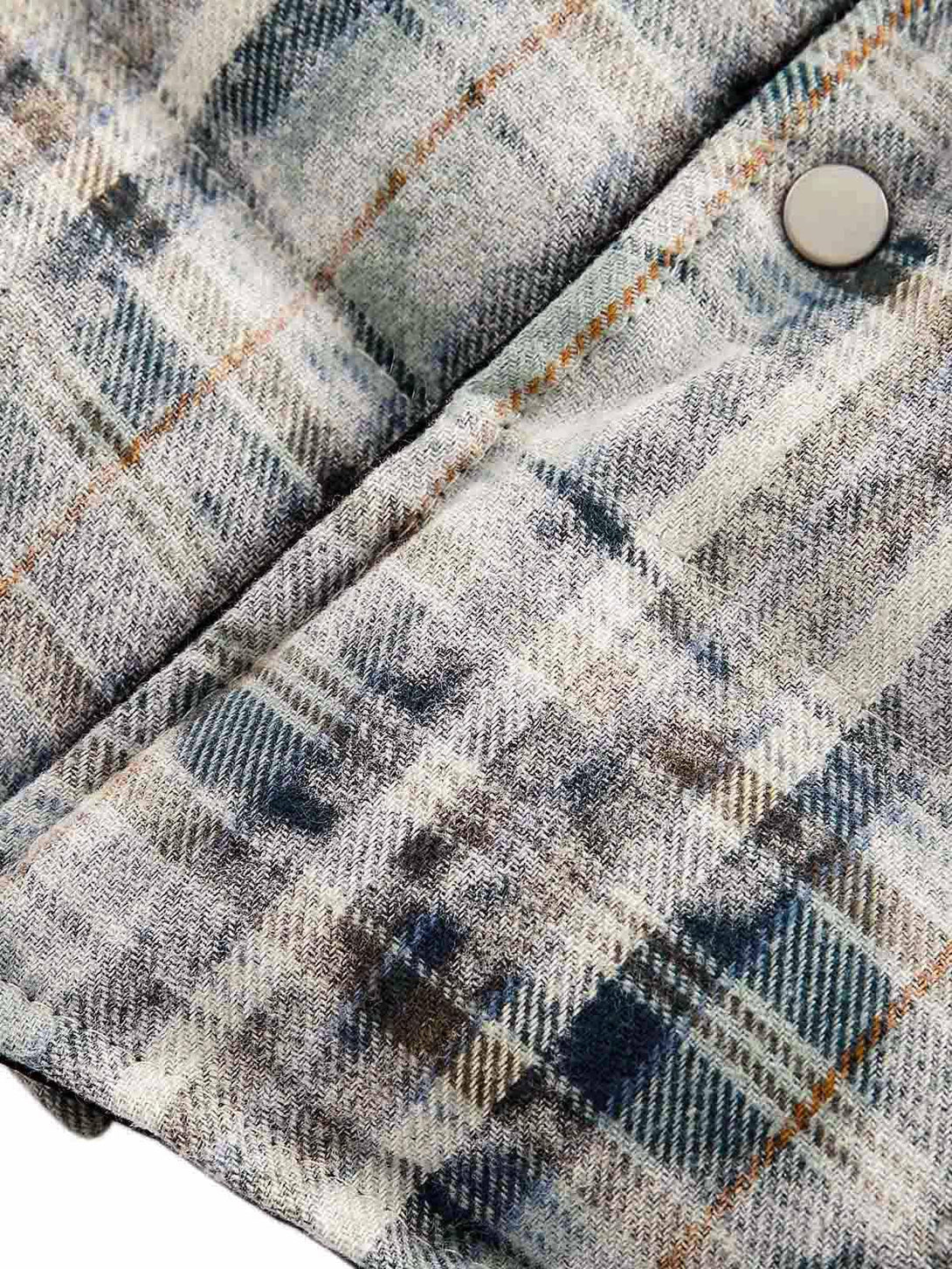 A detailed view of the plaid cotton reversible jacket by TALISHKO, highlighting its texture.