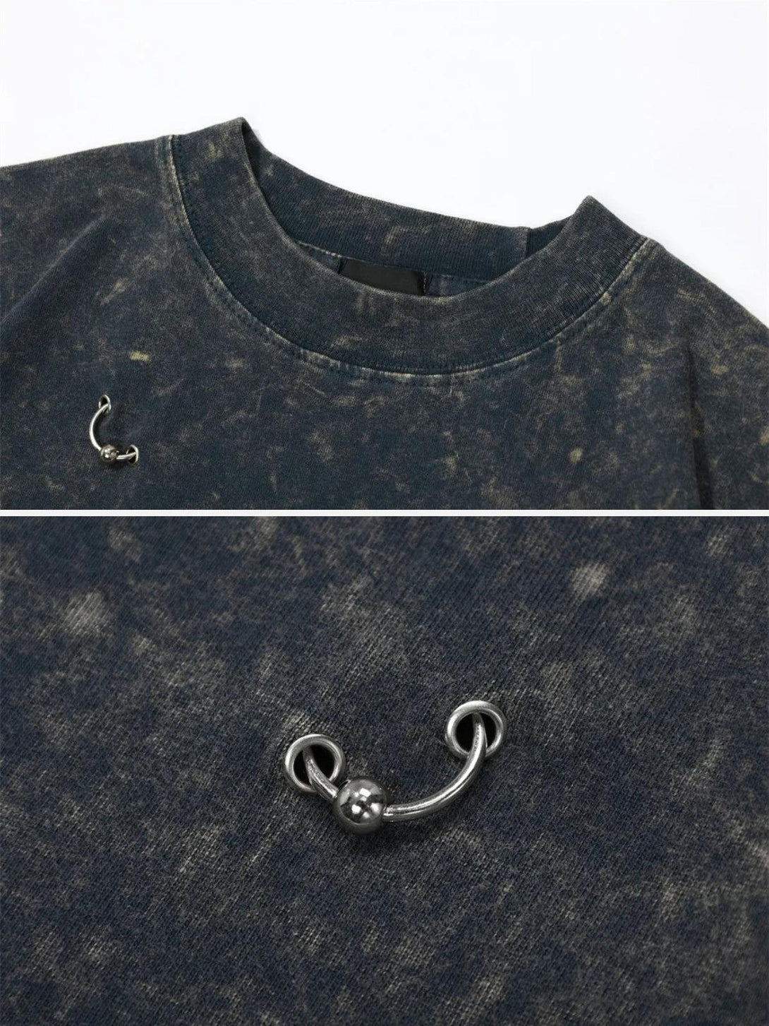 Detailed view of a TALISHKO tee, showcasing a silver accent on the distressed fabric.