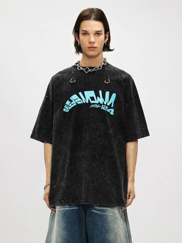 Model wearing a crack letter print tee by TALISHKO, showcasing a relaxed and edgy style.