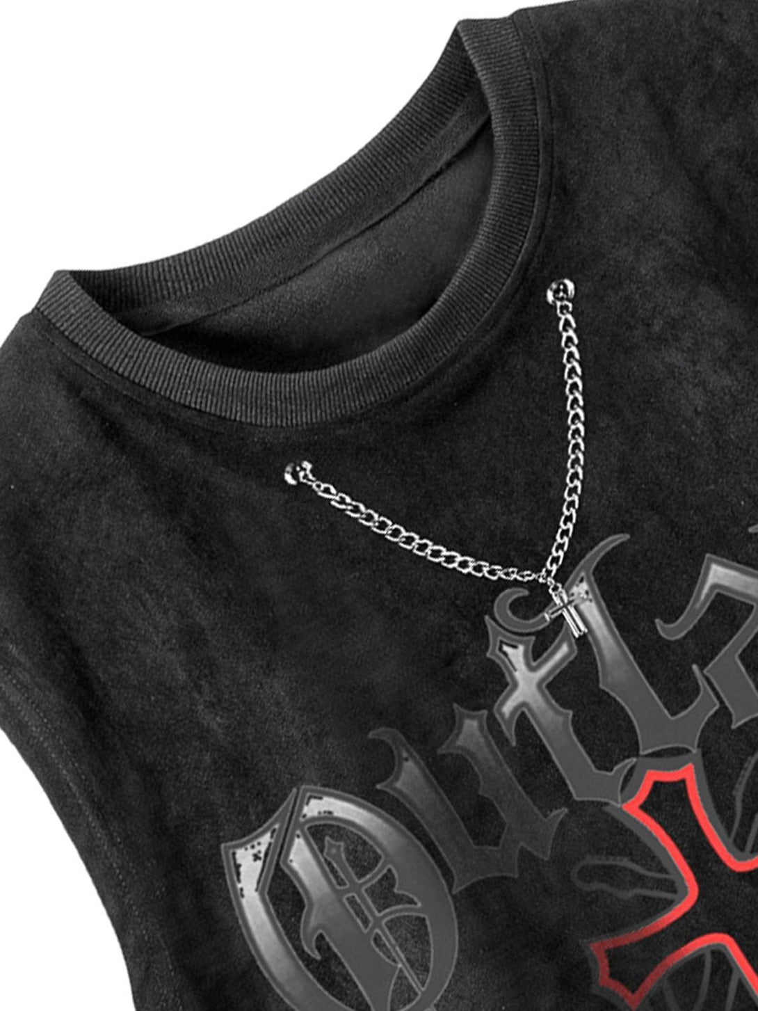 A detailed view of TALISHKO's suede vest, showcasing chain accents and bold graphic design.