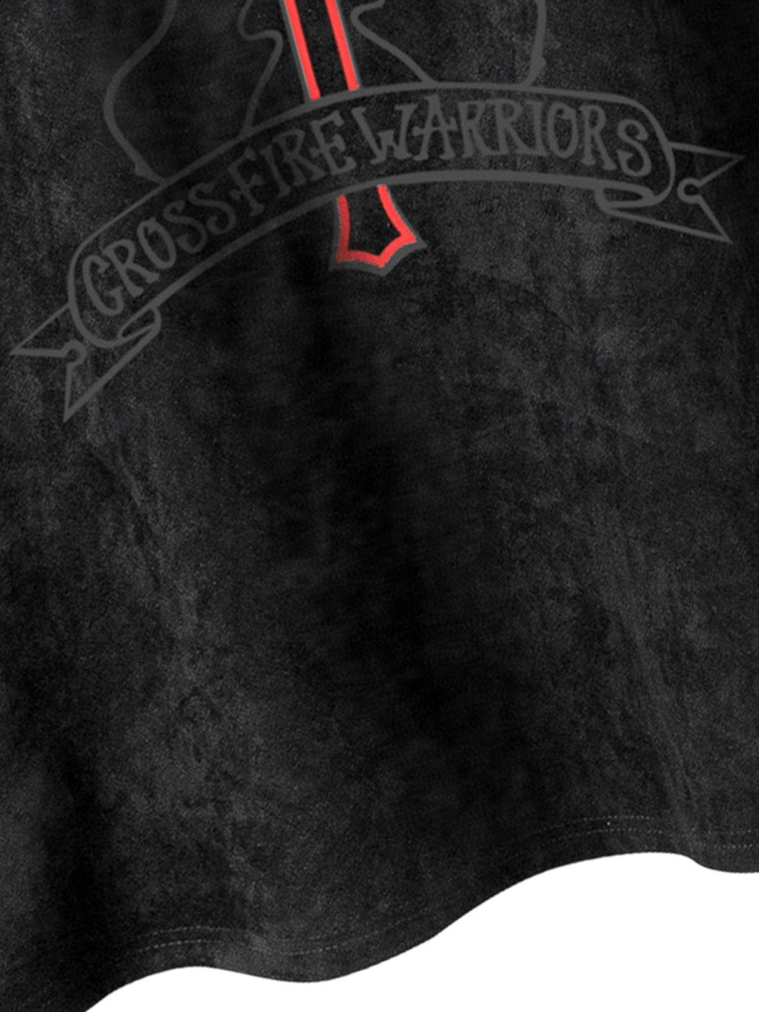 A close-up of TALISHKO's suede vest, highlighting the bold "Crossfire Warriors" graphic.