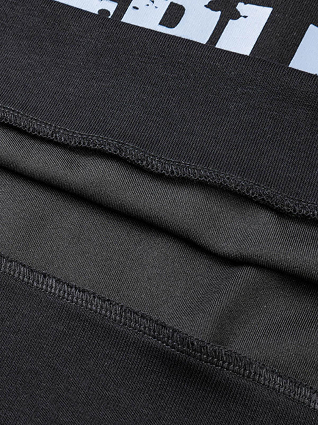 Detailed fabric and stitching of the TALISHKO cross graphic hoodie, showcasing its quality.